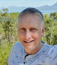 A person smiling at the camera AI-generated content may be incorrect.